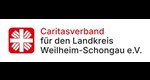Neues Caritaslogo: weißes Flammenkreuz auf rotem Untergrund, rechts daneben der Schriftzug Caritas Weilheim Schongau in rot und schwarz